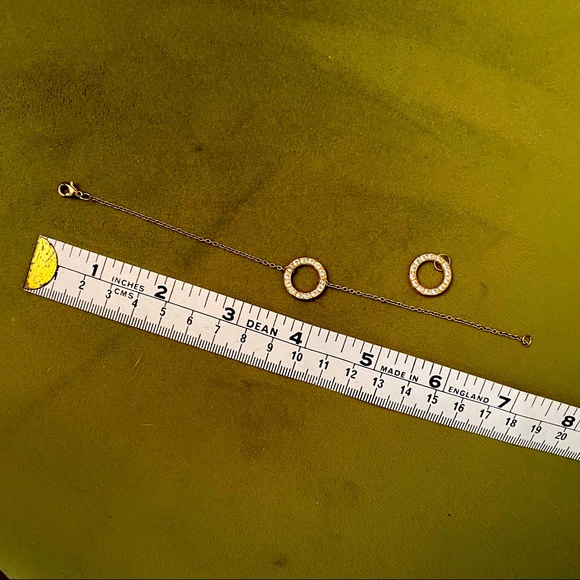 Gold tone chain bracelet with faux diamonds and faux diamond pendant to match. - Picture 3 of 3